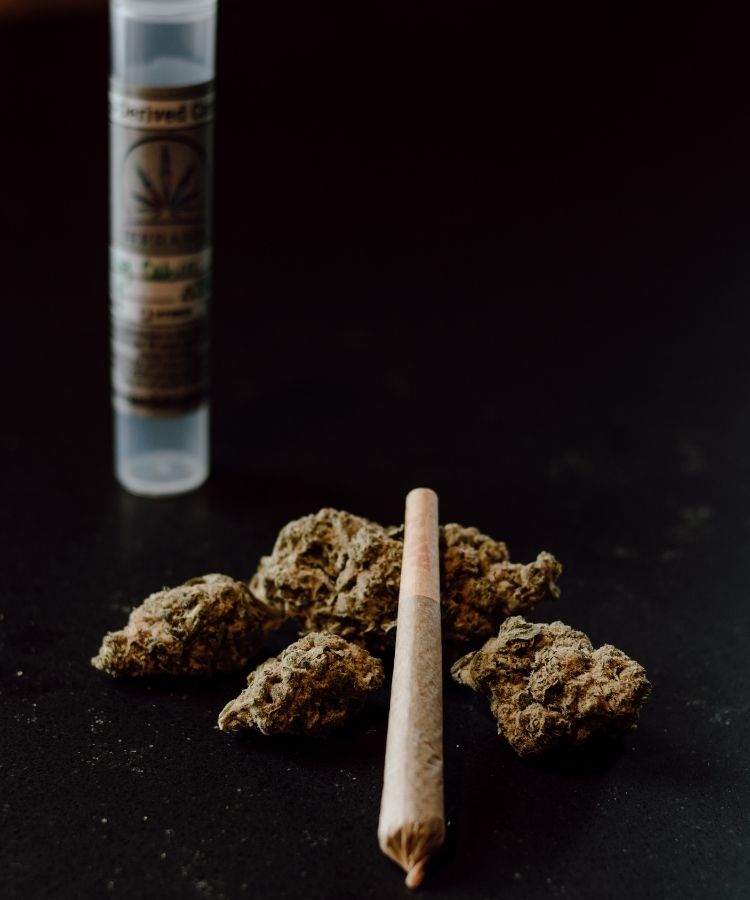 Pre-rolled joint and nugs with RAW papers. TerraSol in Menomonee Falls.